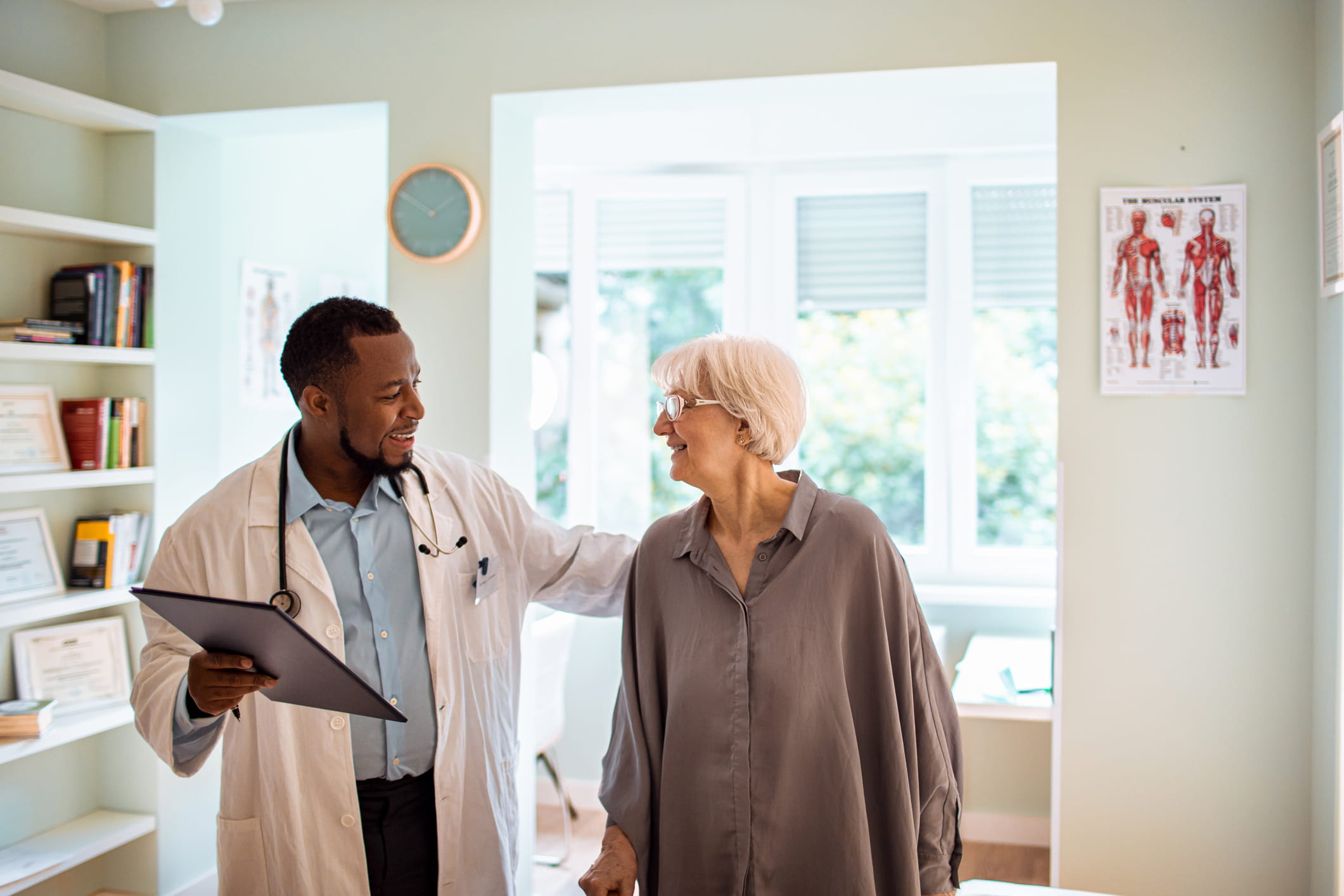 Dr and elderly female pt_iStock-1254897816